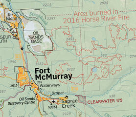 Fort McMurray shown inside the large outline of the 2016 wildfire.